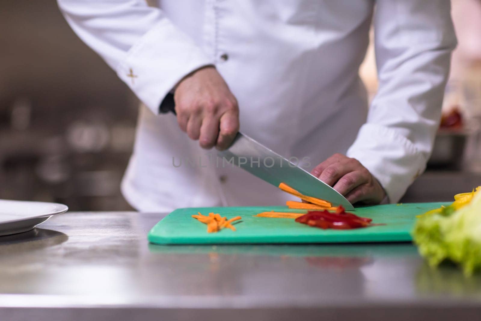 Chef hands cutting fresh and delicious vegetables for cooking or salad