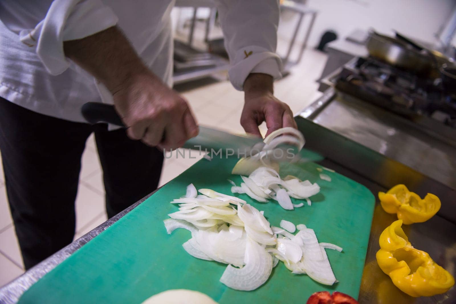 Chef hands cutting fresh and delicious vegetables for cooking or salad