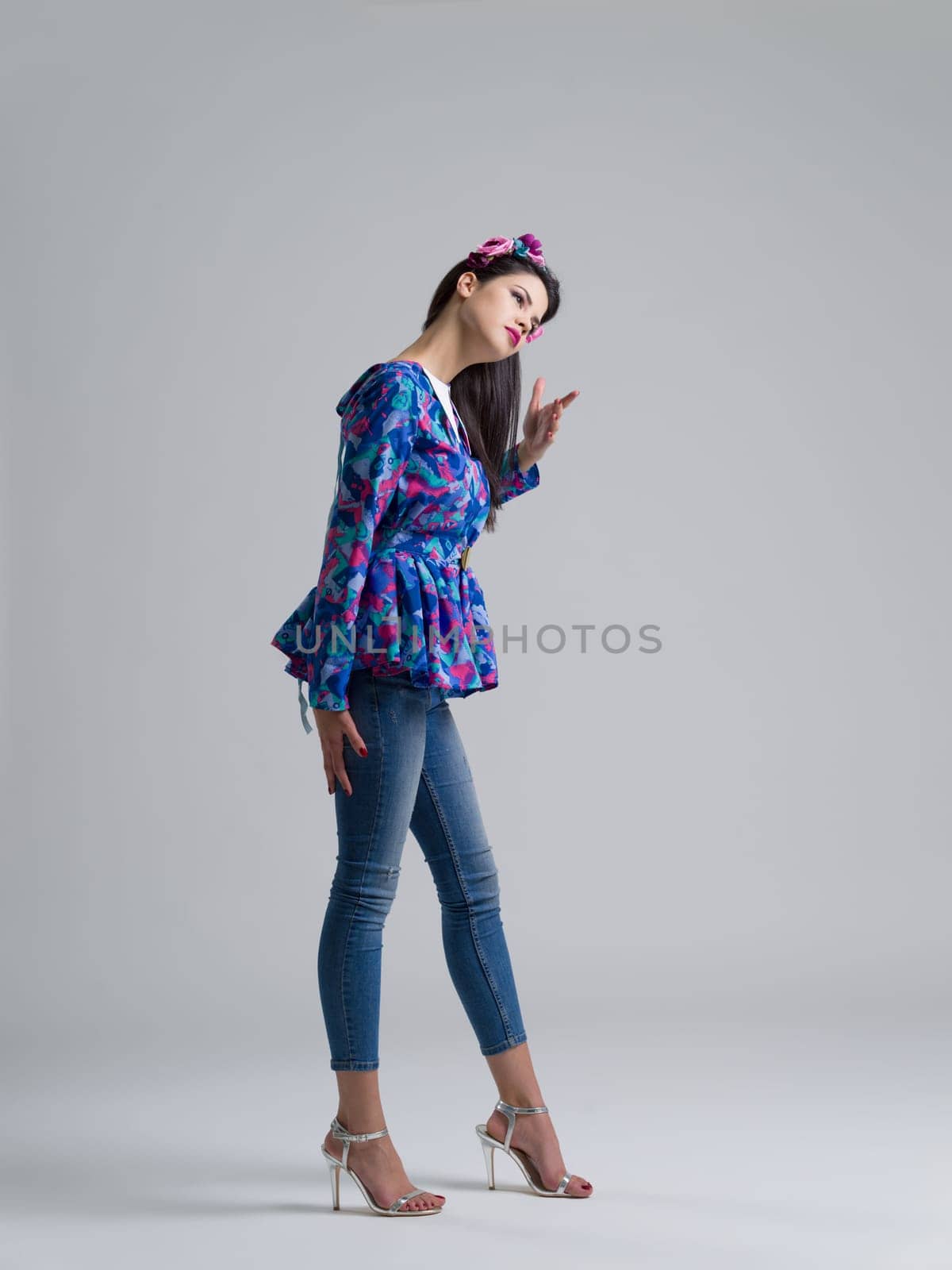 Fashion Model girl isolated over white background. Beauty stylish woman posing in fashionable clothes  Casual style with beauty accessories. High fashion urban style