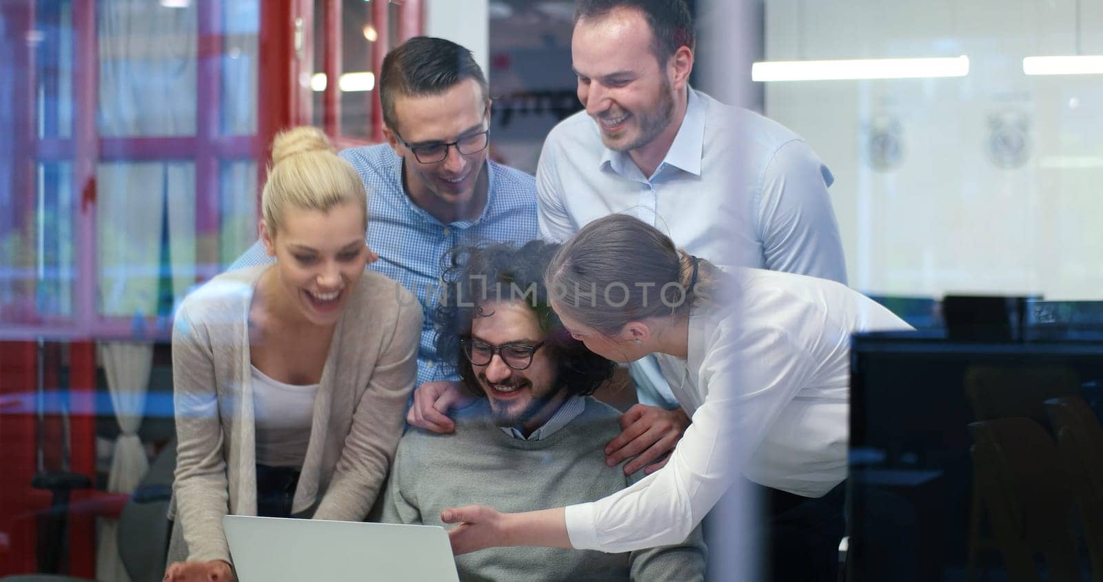 Group of a young business people discussing business plan at modern startup office building