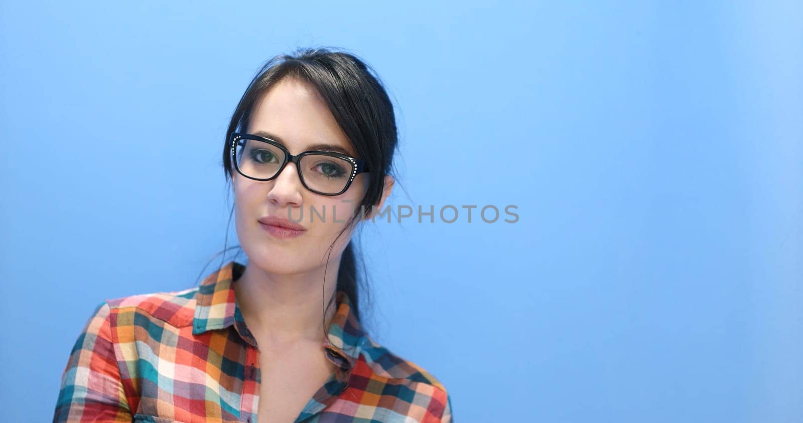 Attractive Young Woman Wearing glasses on colorfull background