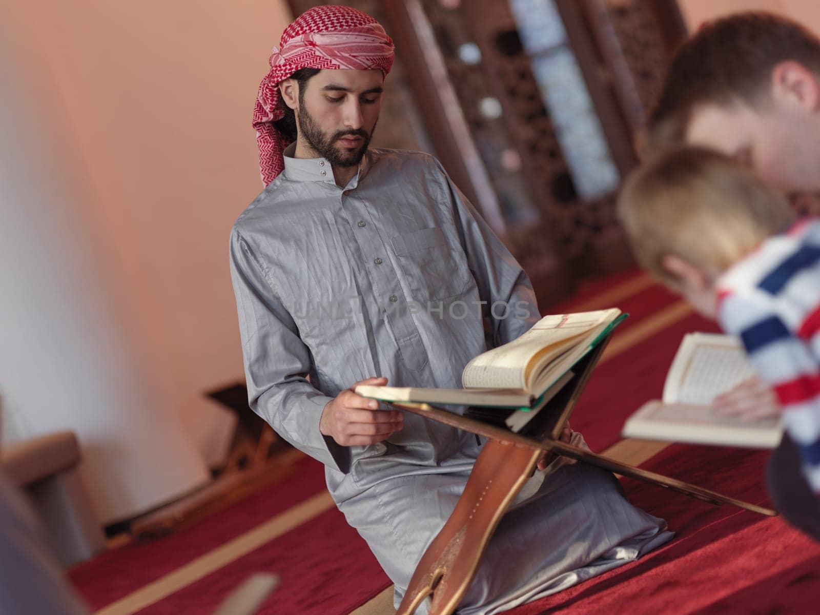 muslim people in mosque reading quran together concept of islamic education and school of holly book kuran