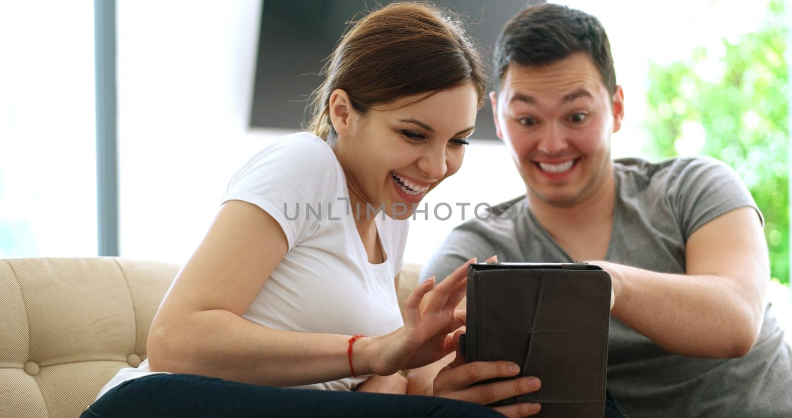 Young Couple using interent on digital tablet