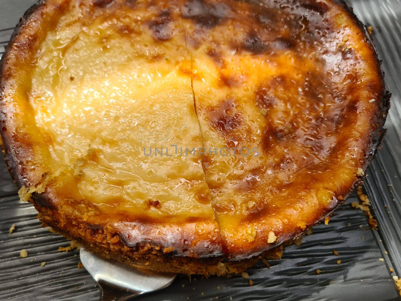 Whole apple kuchen cake in fall setting.