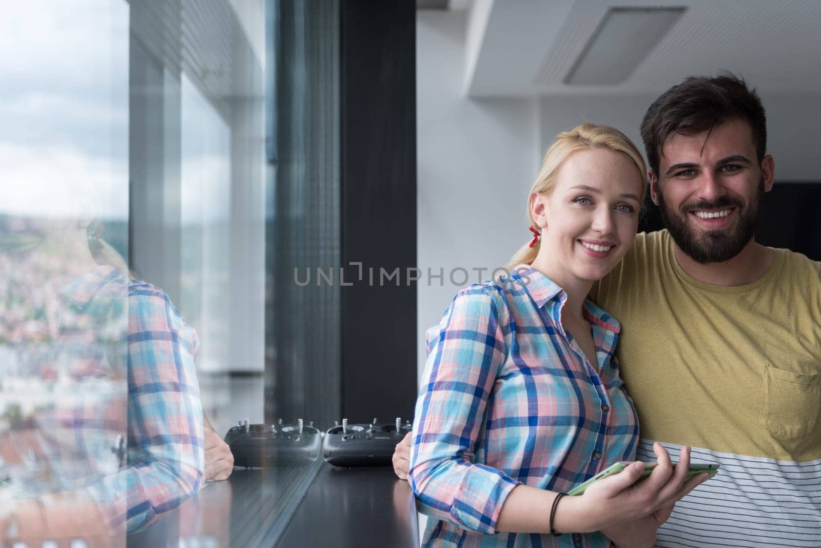 two business people preparing for next meeting and discussing ideas by the window
