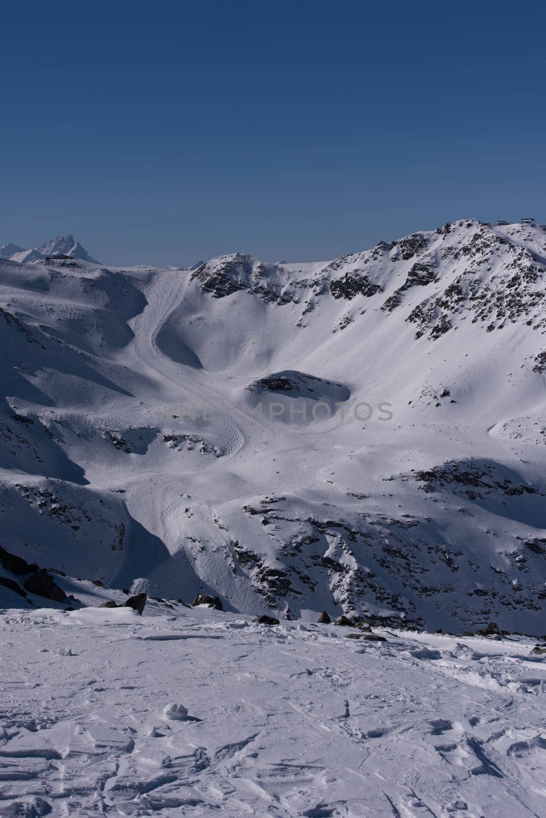 mountain landscape at winter with fresh snow on beautiful sunny day at french alps