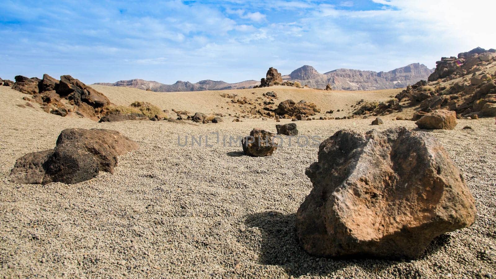 Landscape of volcanic rocks and in desert at bright sunny day. Martian terrain landscape.