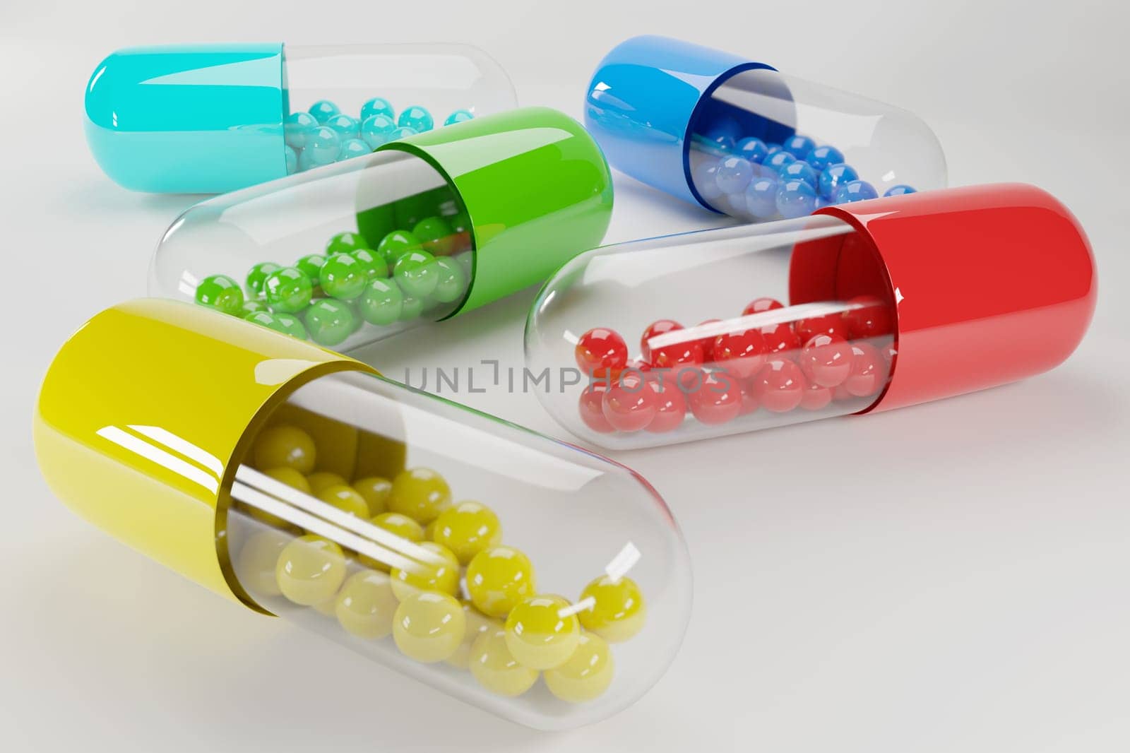 Group of transparent colored medication capsules or pills with content colored balls. Vitamins and nutrition bade.