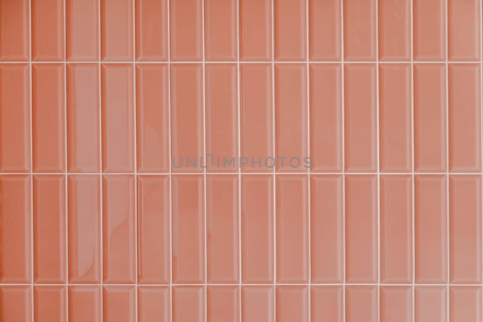 Pink glossy upright rectangular ceramic tile, background, texture.