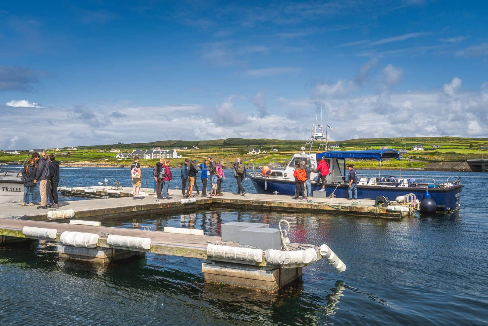 Portmagee, Ireland, August 2019 Group of tourists boarding a cruise boat to visit Skellig Michael island where Star Wars were filmed, Ring of Kerry