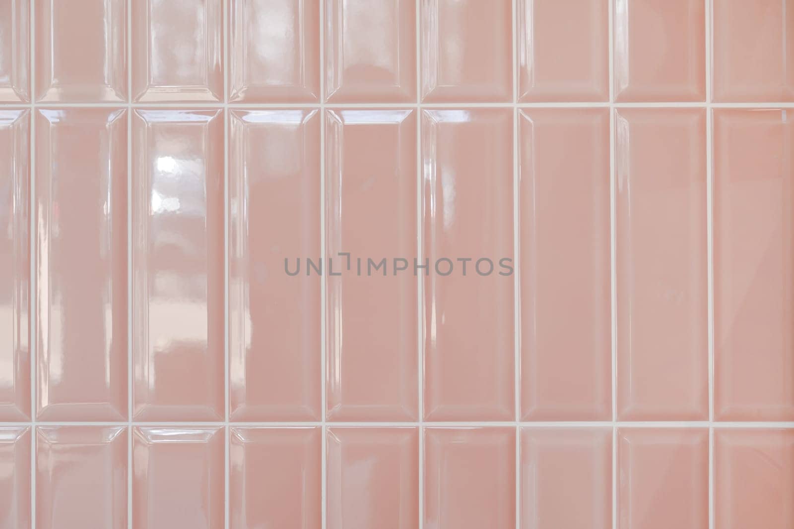 Pink glossy upright rectangular ceramic tile, background, texture.