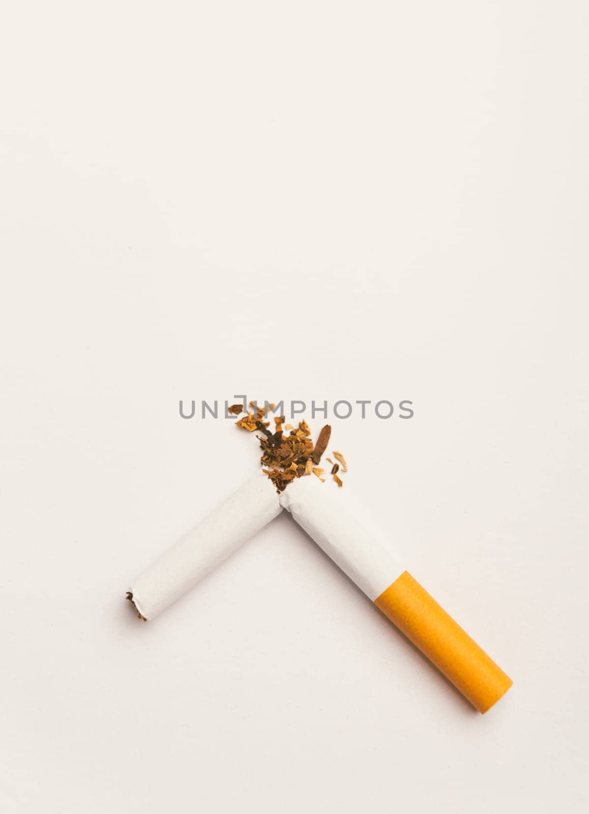 31 May of World No Tobacco Day, no smoking, close up of broken pile cigarette or tobacco STOP symbolic on white background with copy space, and Warning lung health concept