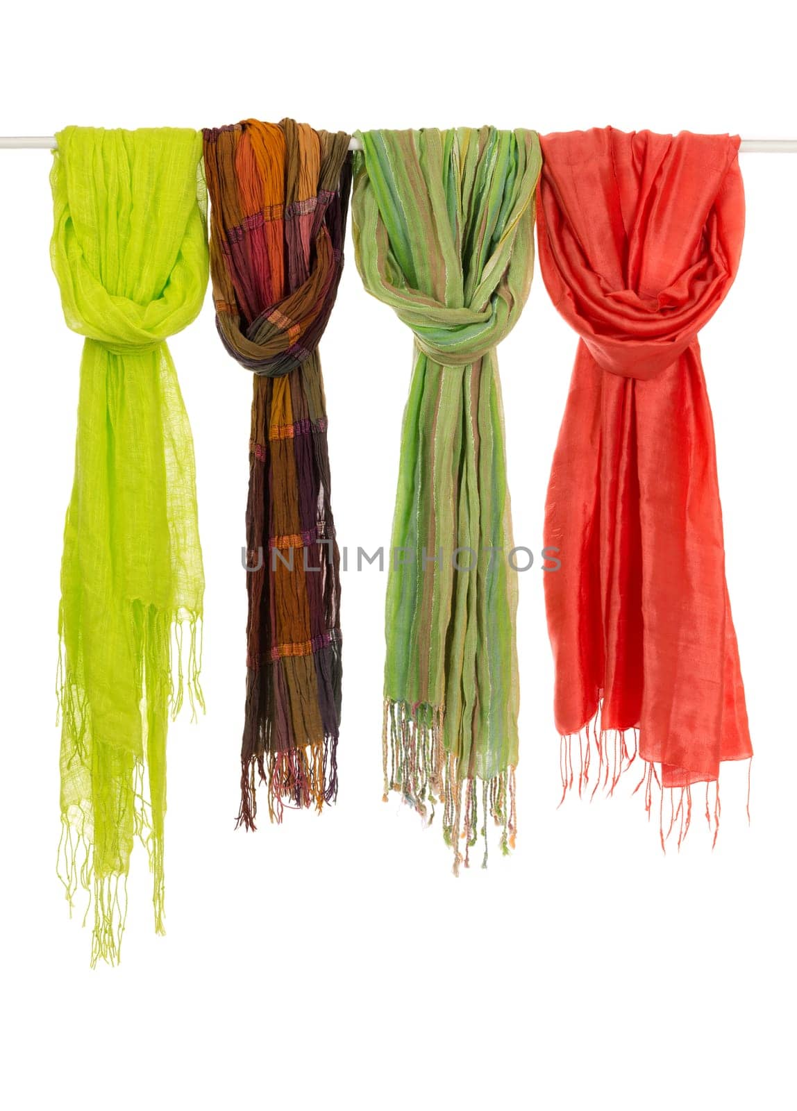 Silk colored scarves on a hanger. Isolate on white