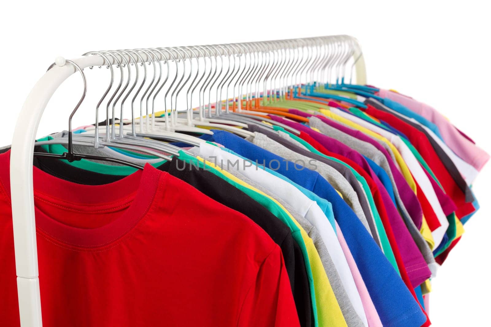 Multi colored shirts on wooden hangers. Isolate on white.