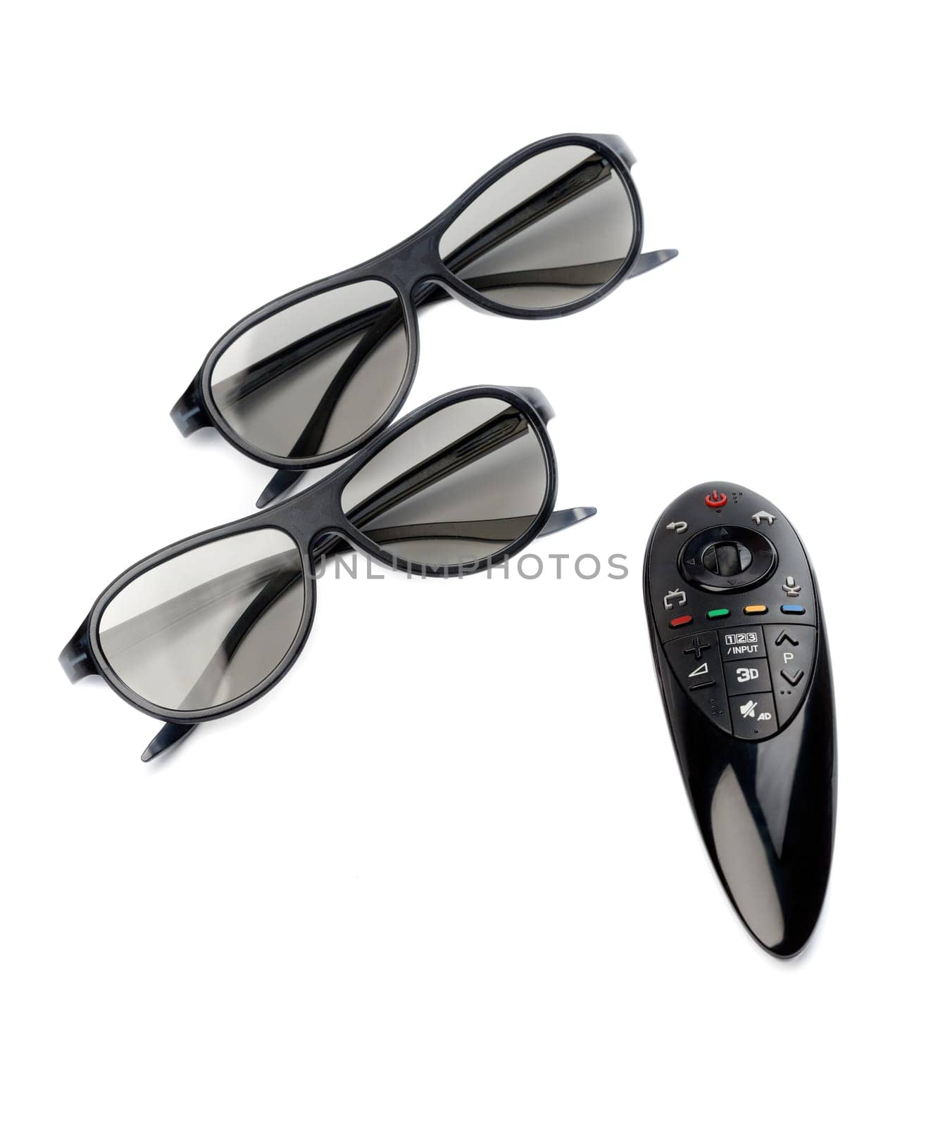 Two pairs of 3D glasses and remote control TV. Isolate on white.
