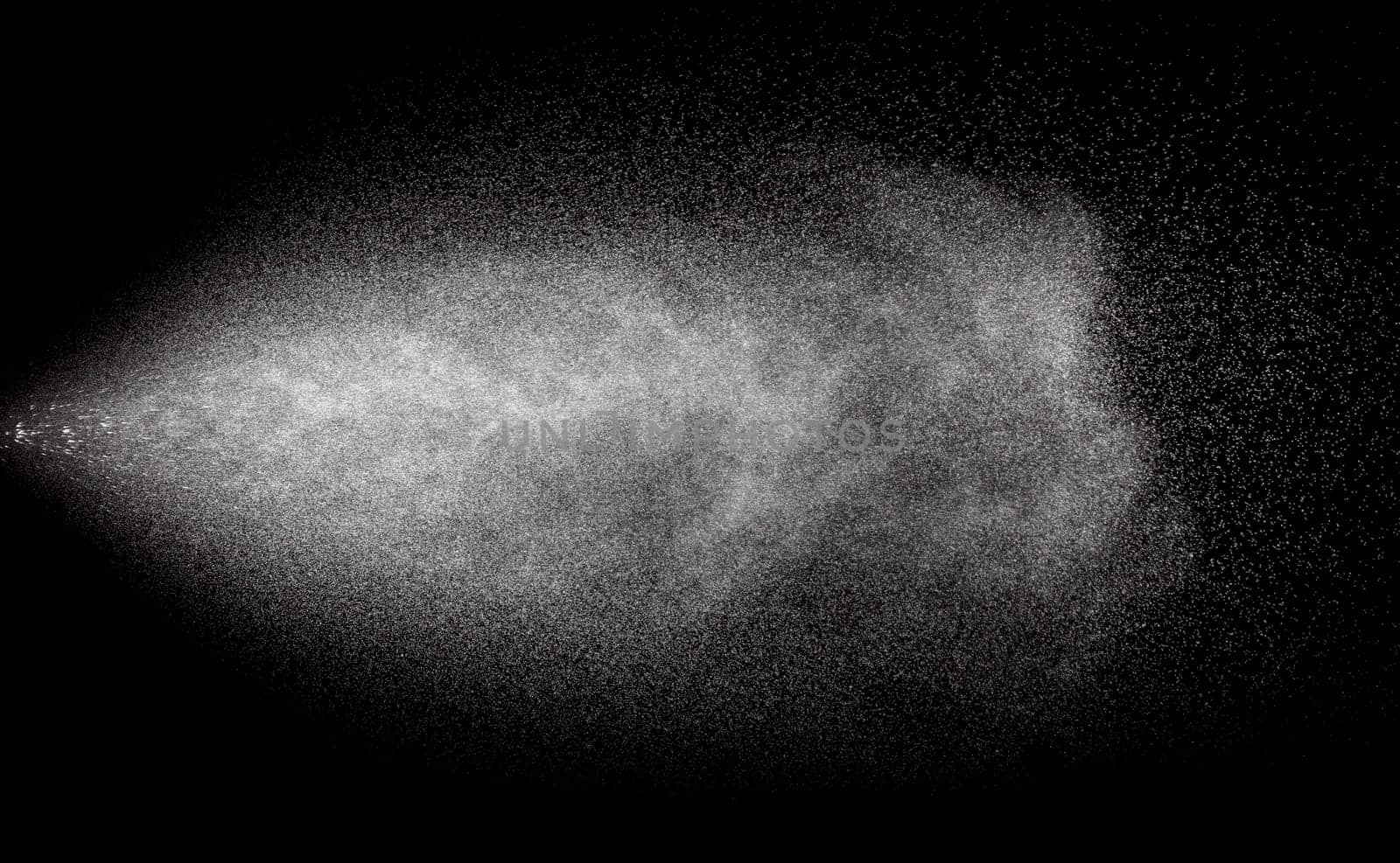 Spraying of water in motion isolate on black background.