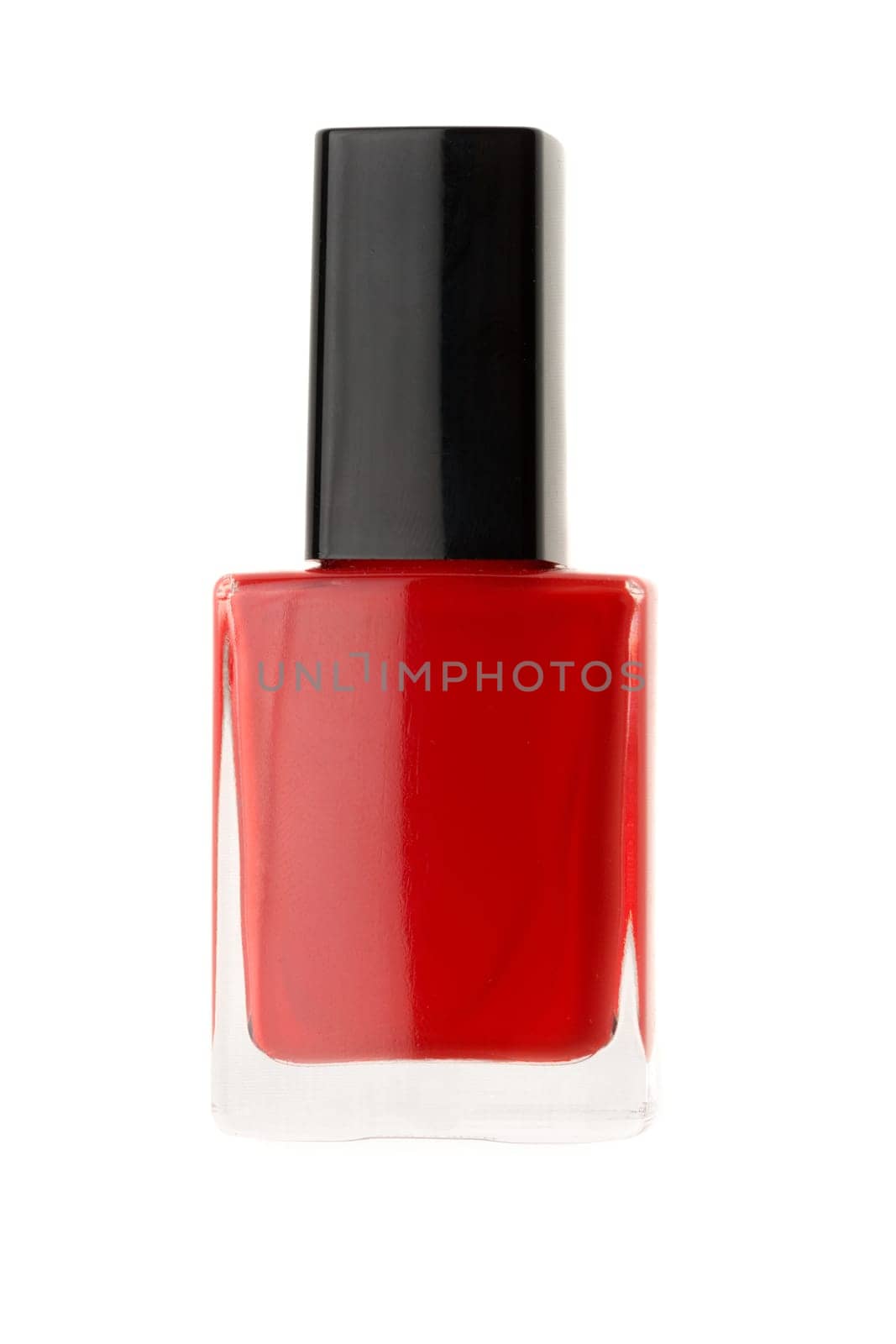 Bottle of red nail polish isolated on a white background.