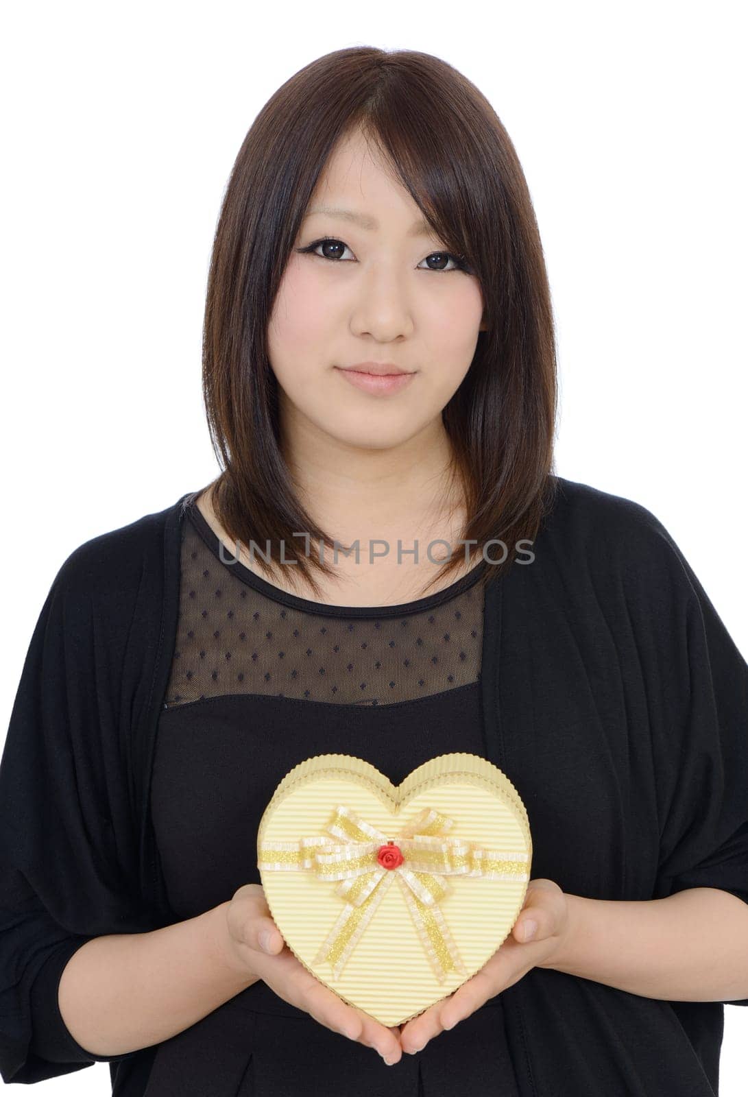 Happy young asian woman holding a gift box
