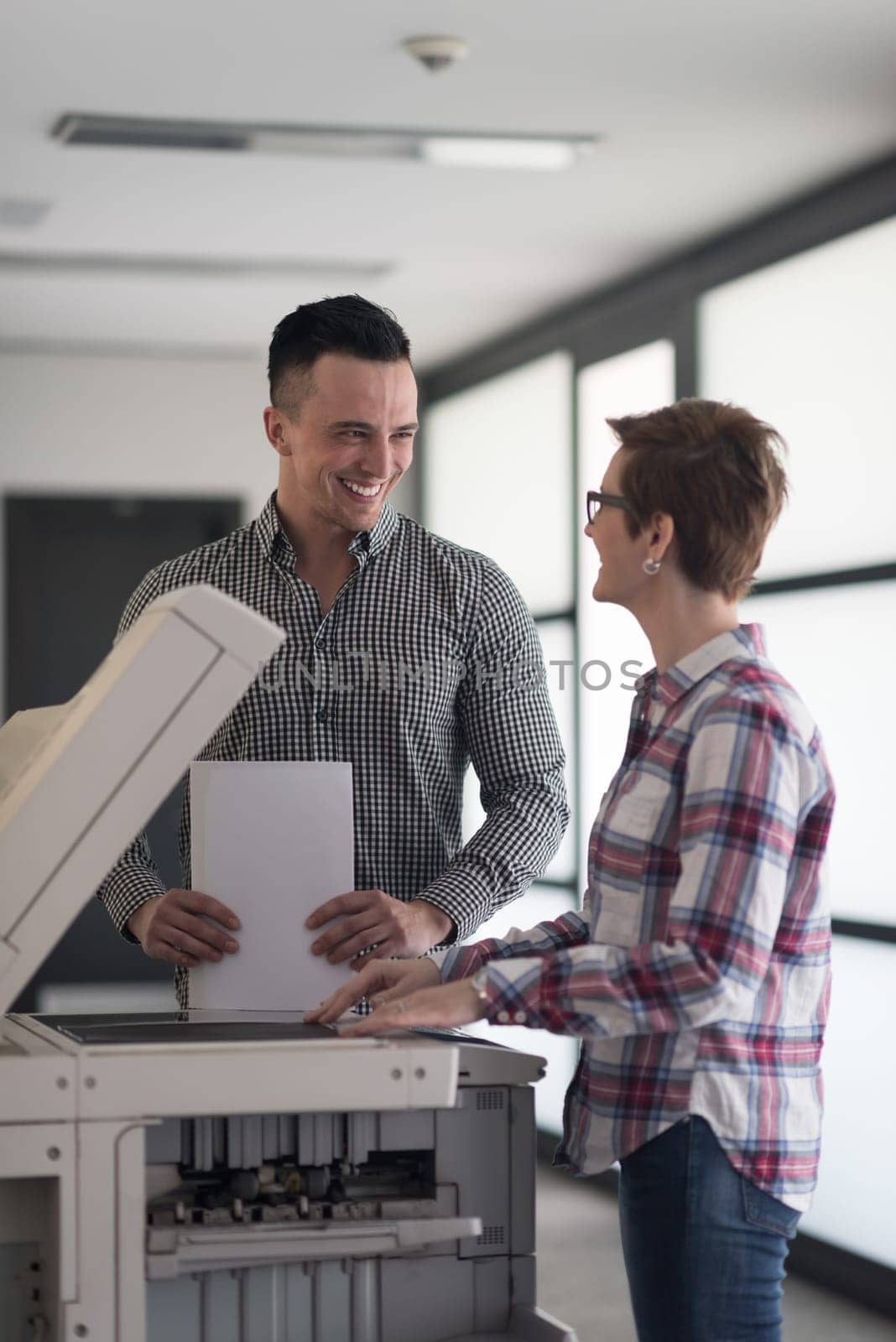 happy business people group at modern office copy  documents on machine