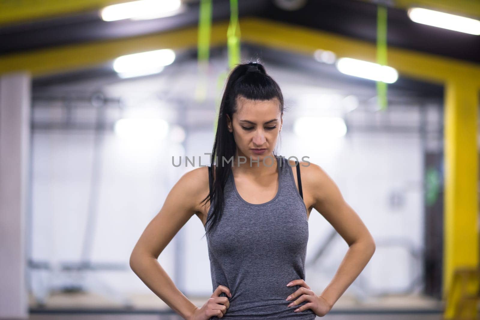 Portrait of young athlete woman at cross fitness gym