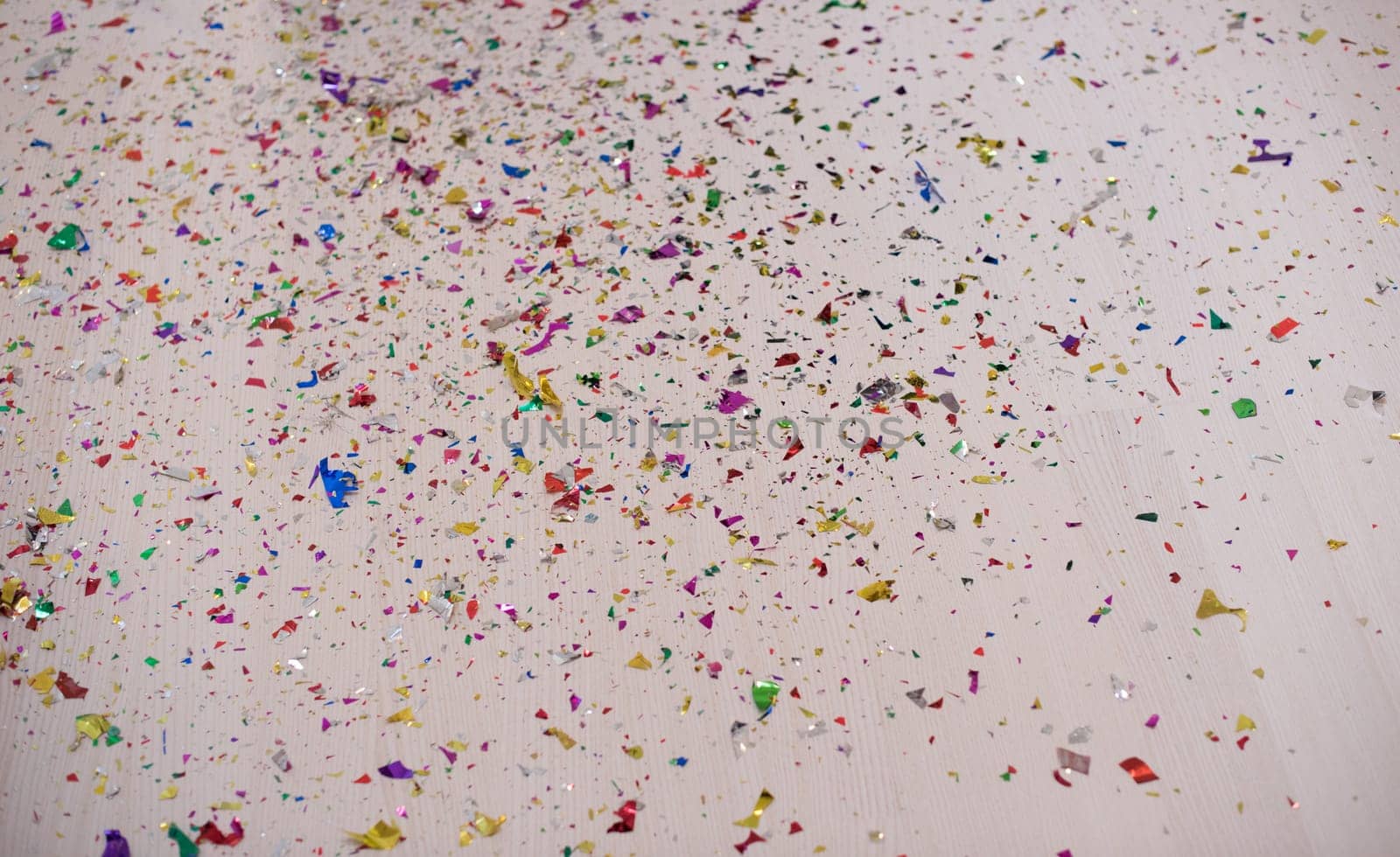 happy young romantic  couple in love  celebrating and blowing confetti decorations at new year and charismas  party