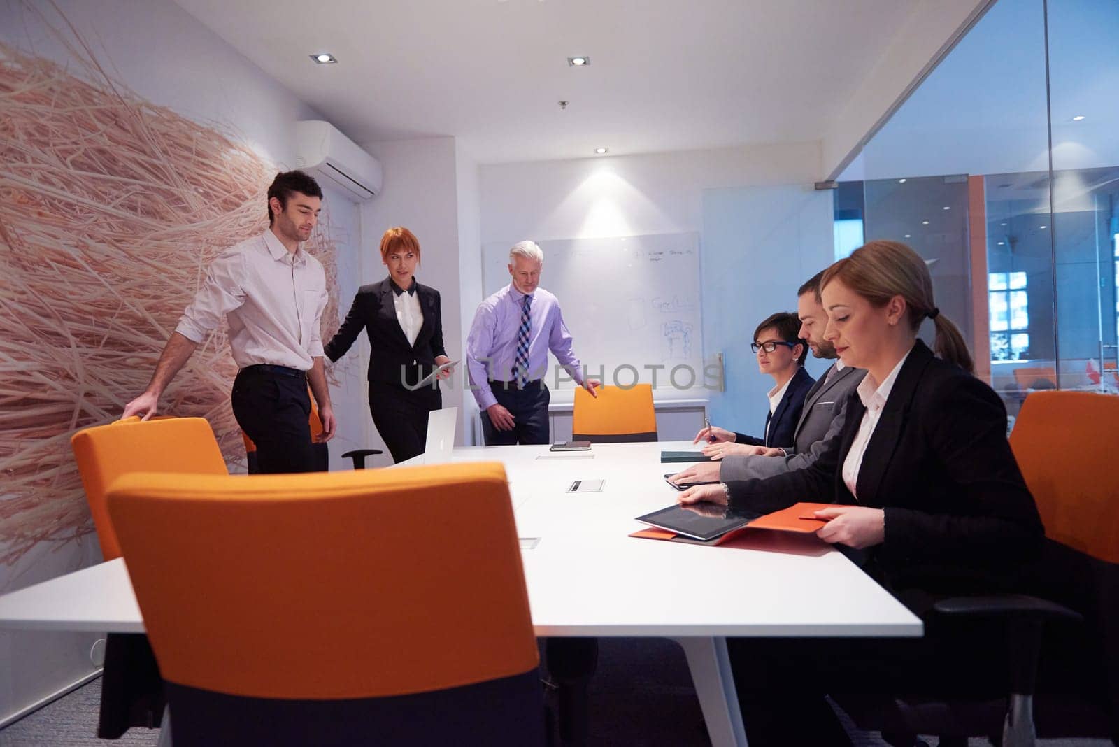 business people group with young adults and senior on meeting at modern bright office interior.
