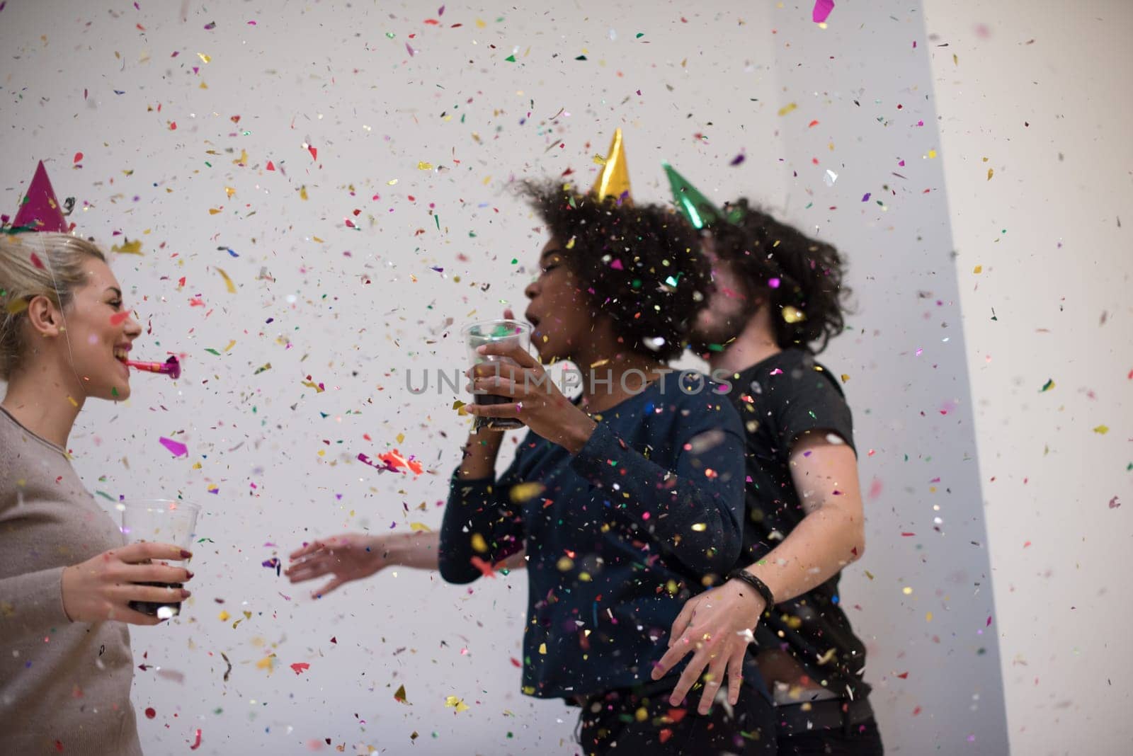 confetti party Multiethnics happy young people group celebrating new year eve while dancing and have fun at home