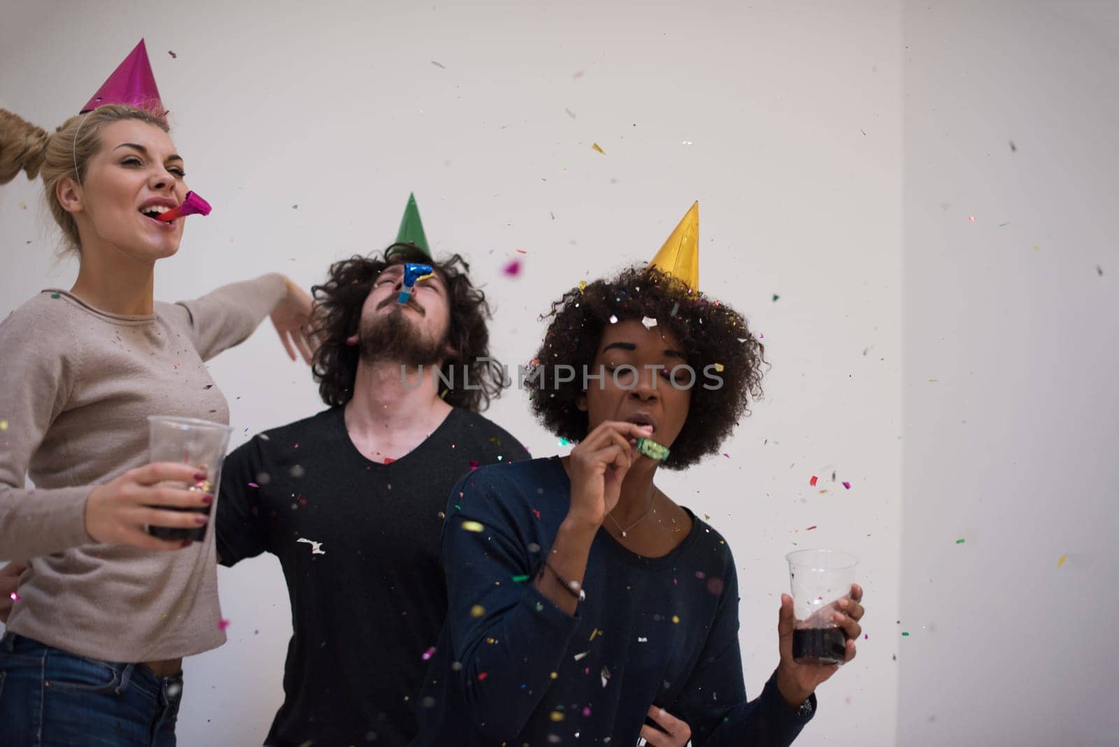 confetti party Multiethnics happy young people group celebrating new year eve while dancing and have fun at home