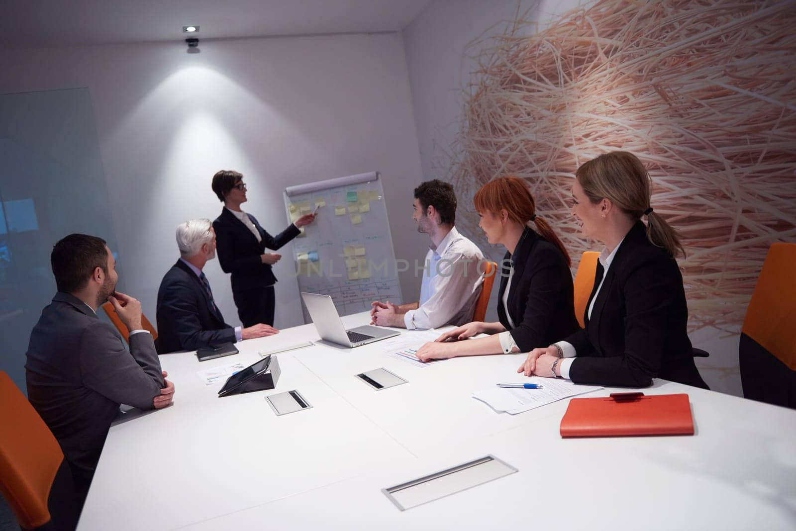 business people group with young adults and senior on meeting at modern bright office interior.