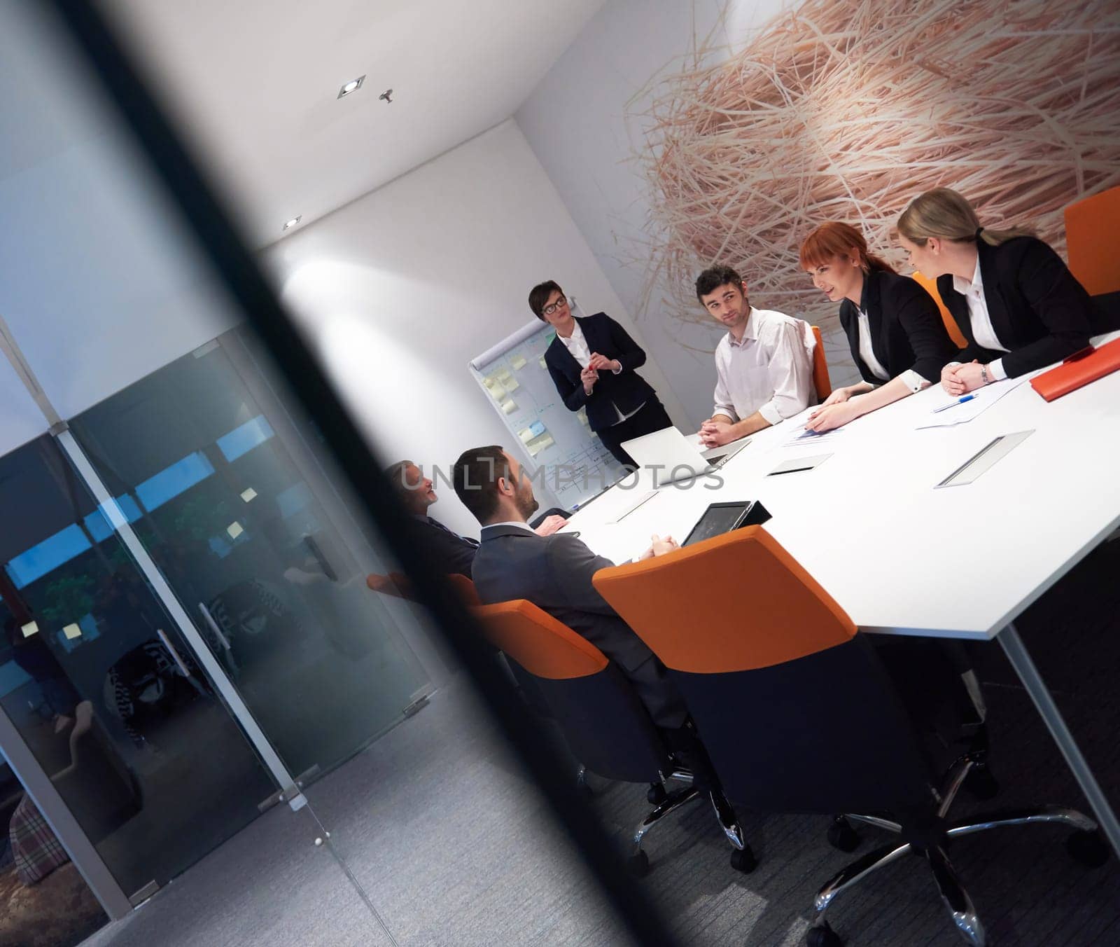 business people group with young adults and senior on meeting at modern bright office interior.