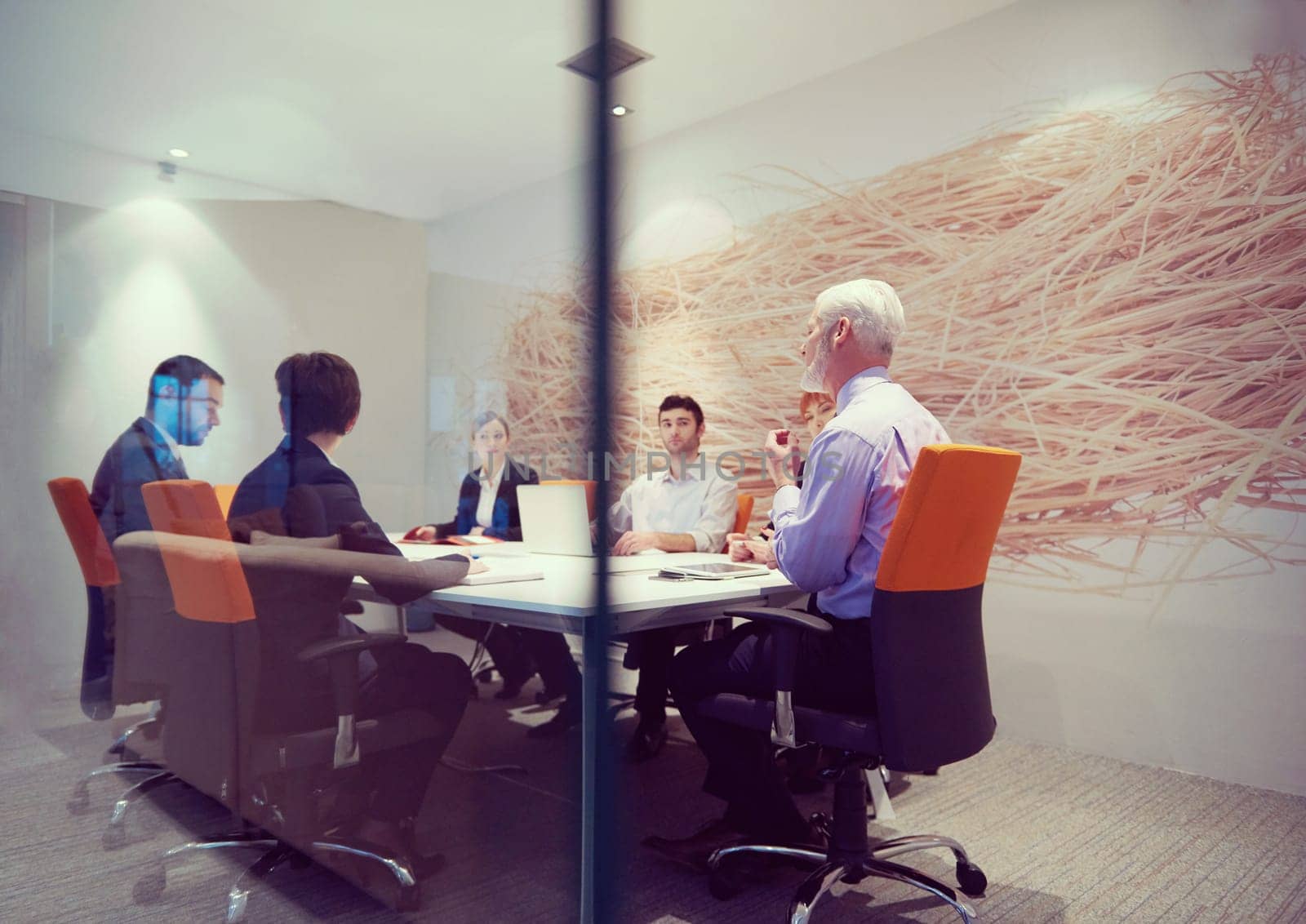 business people group with young adults and senior on meeting at modern bright office interior.