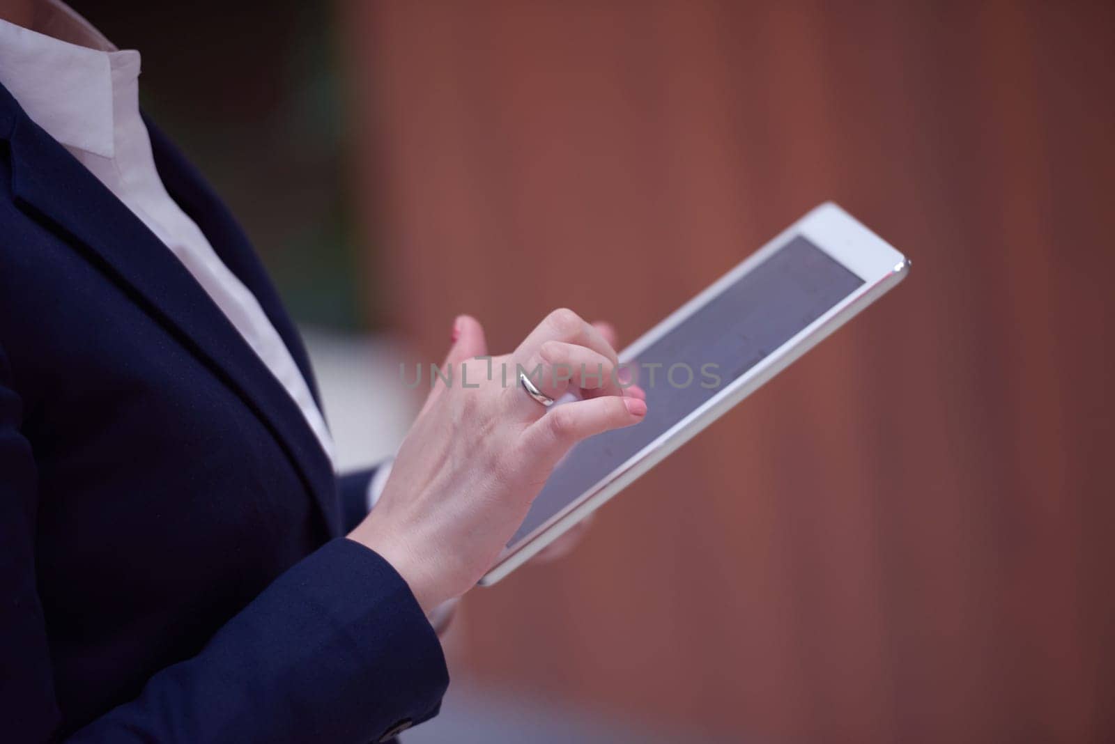 corporate business woman working on tablet computer  at modern office interior