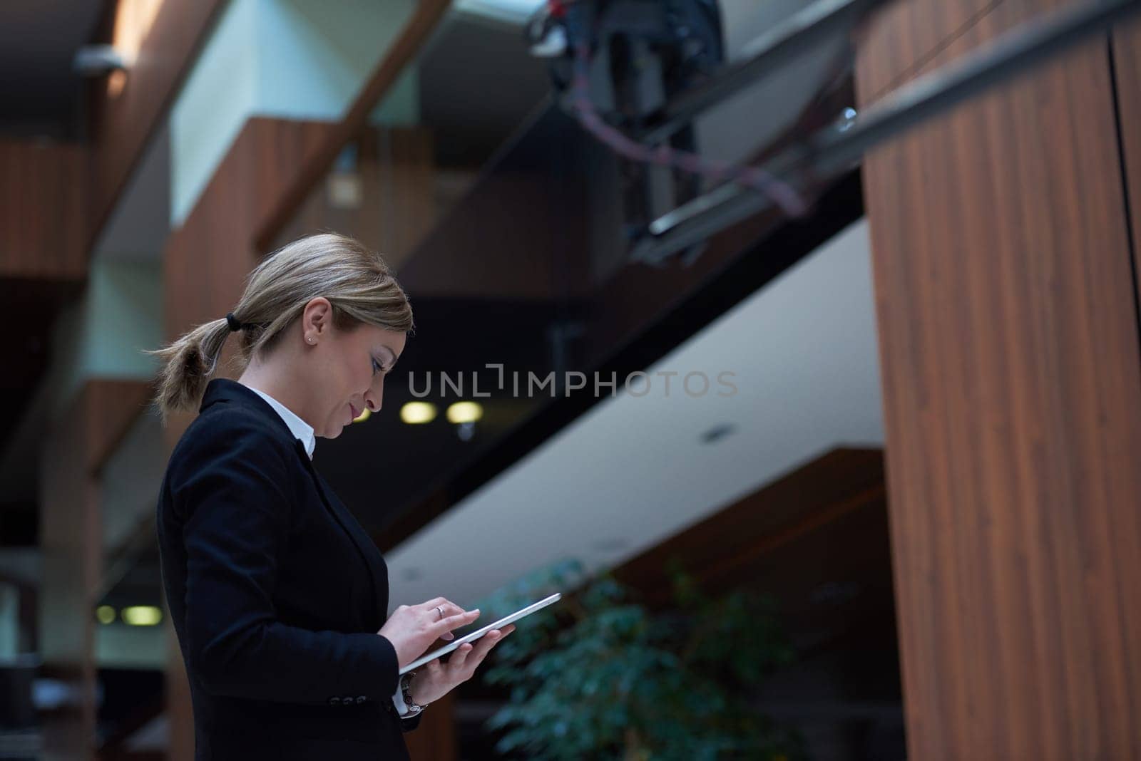 corporate business woman working on tablet computer  at modern office interior