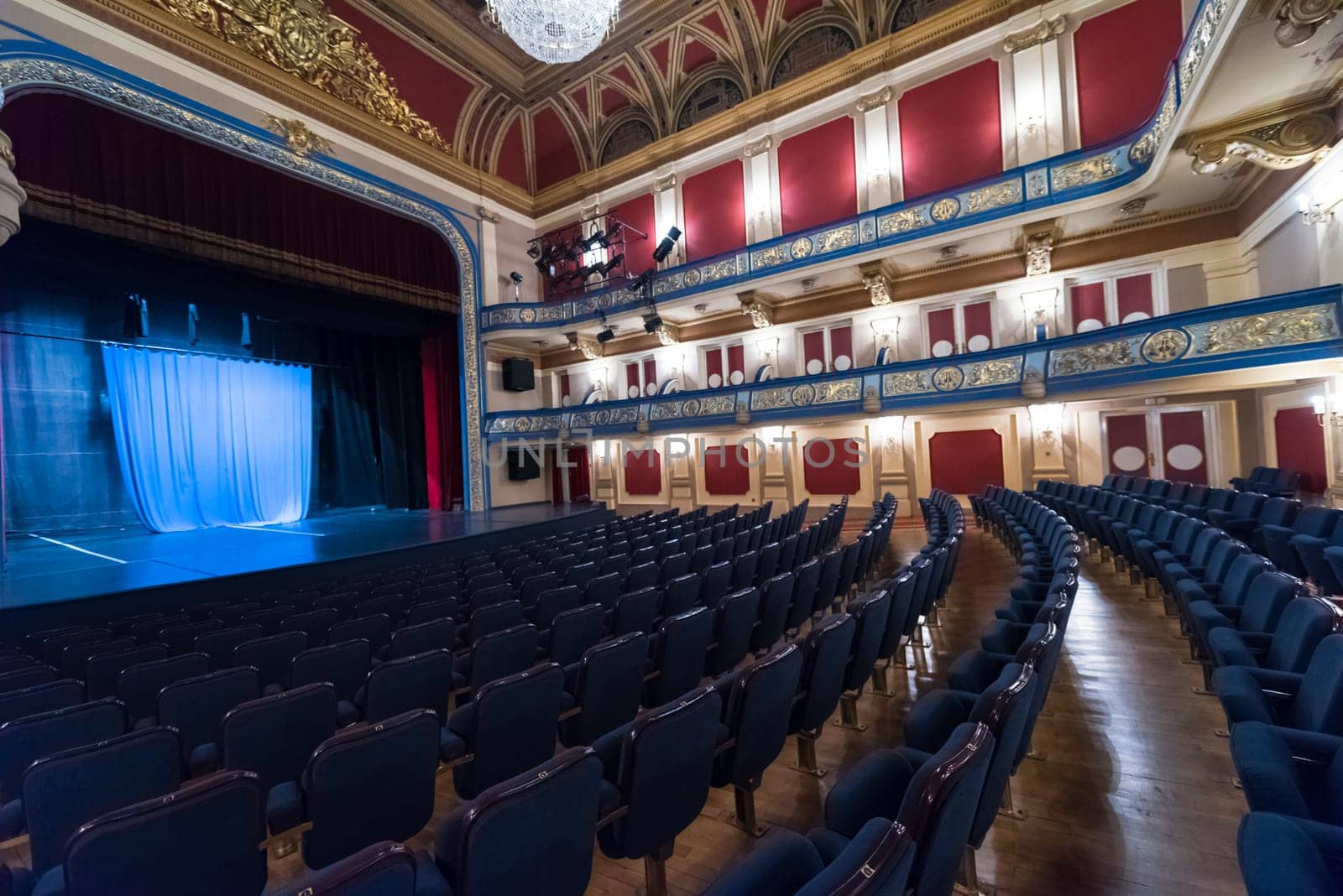 empty theater stage curtain with dramatic lights