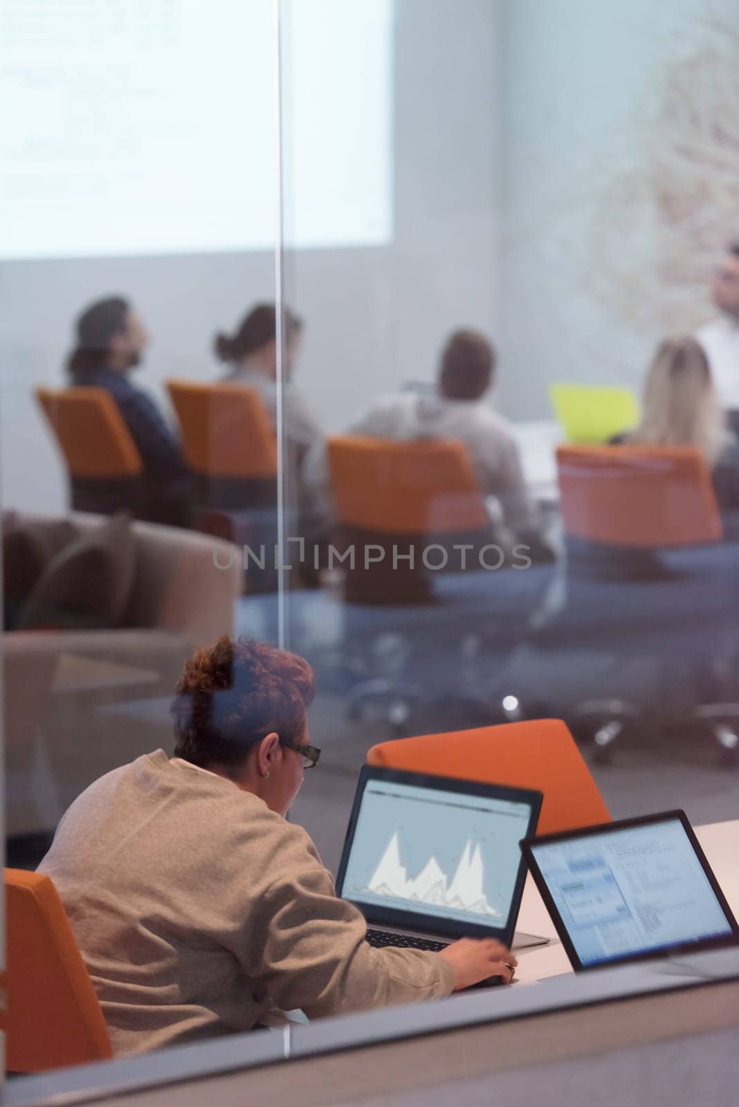 Young female Entrepreneur Freelancer Working Using A Laptop In Coworking space