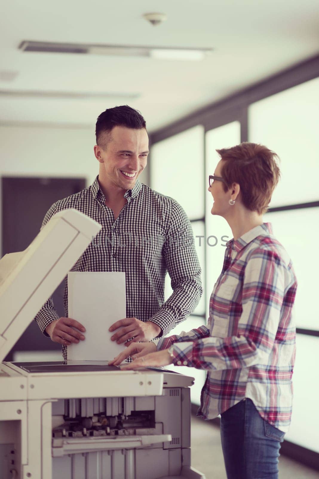 happy business people group at modern office copy  documents on machine