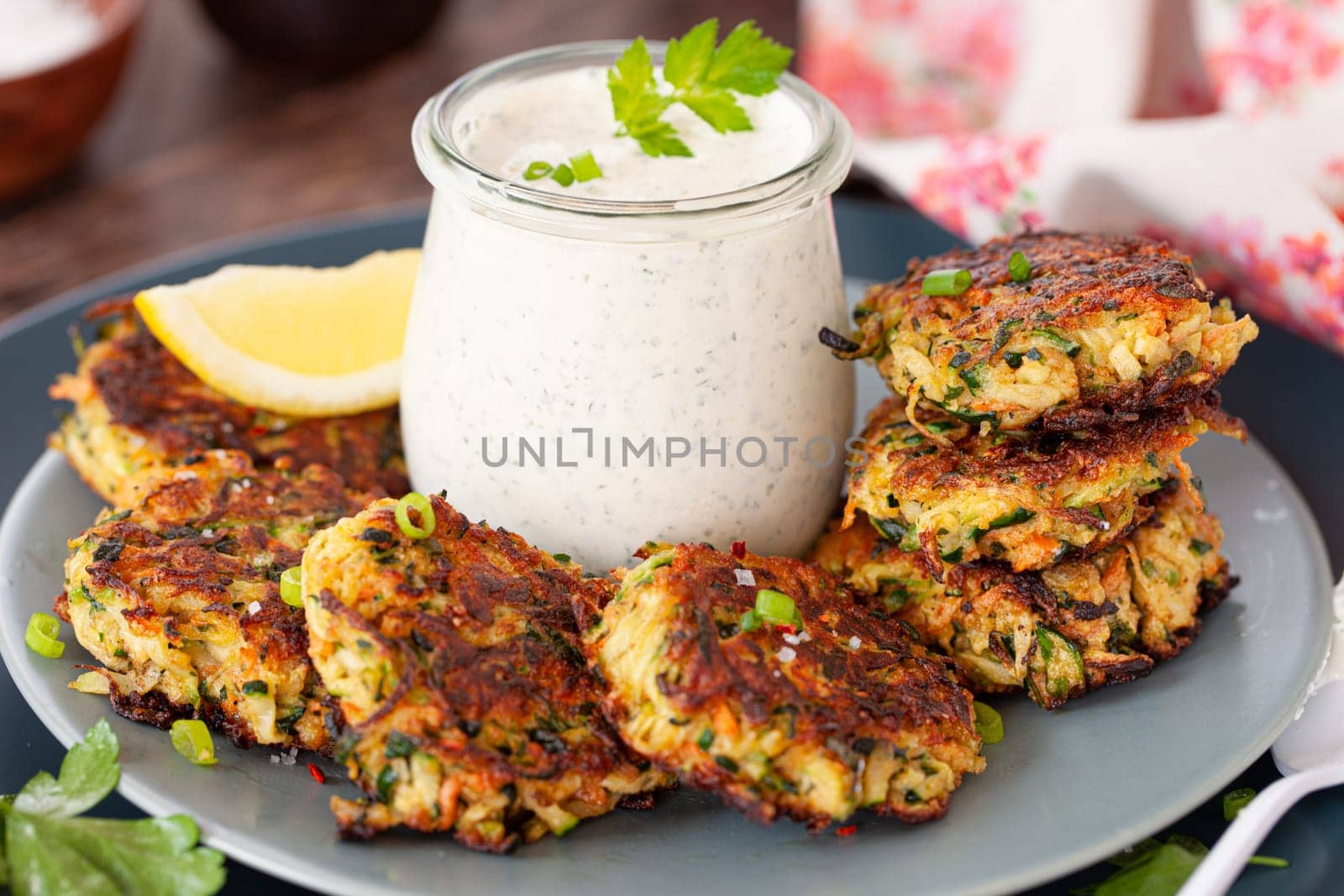 Savory zucchini vegetable fritters with a sour cream dip