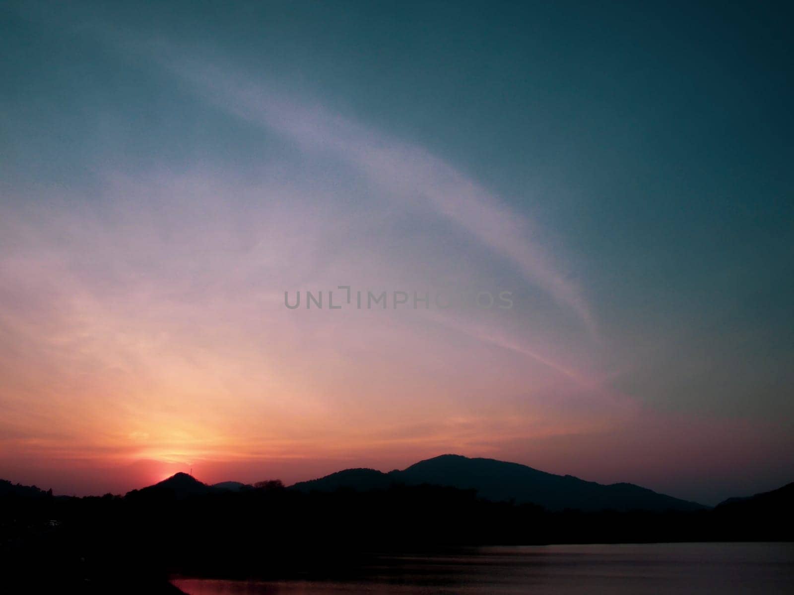 Mountain range at sunset, Lake. View on Mountain Lake in front of mountain range