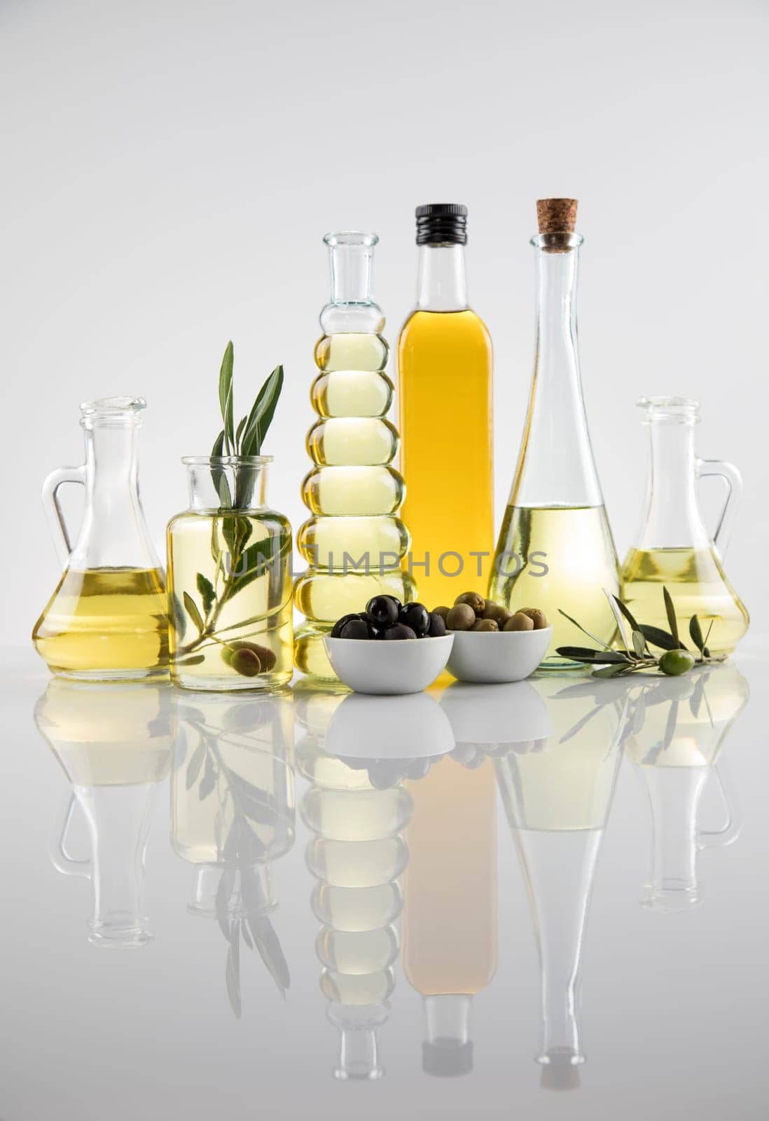Olive oil bottles, olive branch and Cooking oils