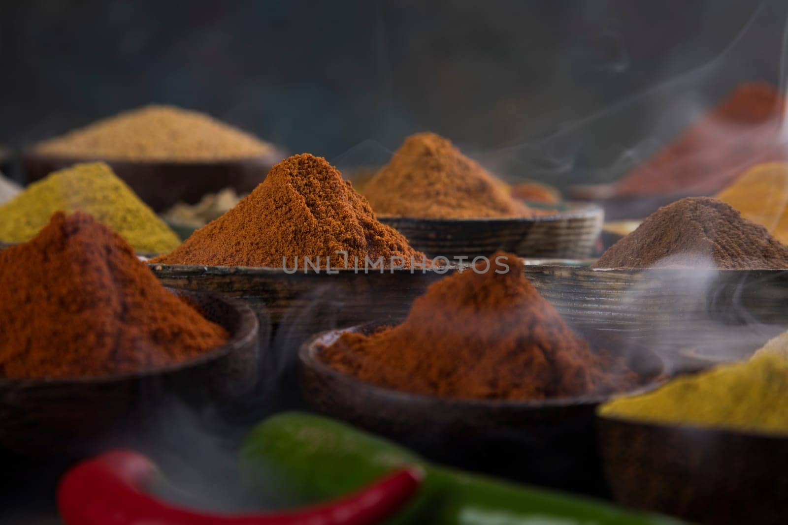 Assorted Spices and wooden bowl of smoke