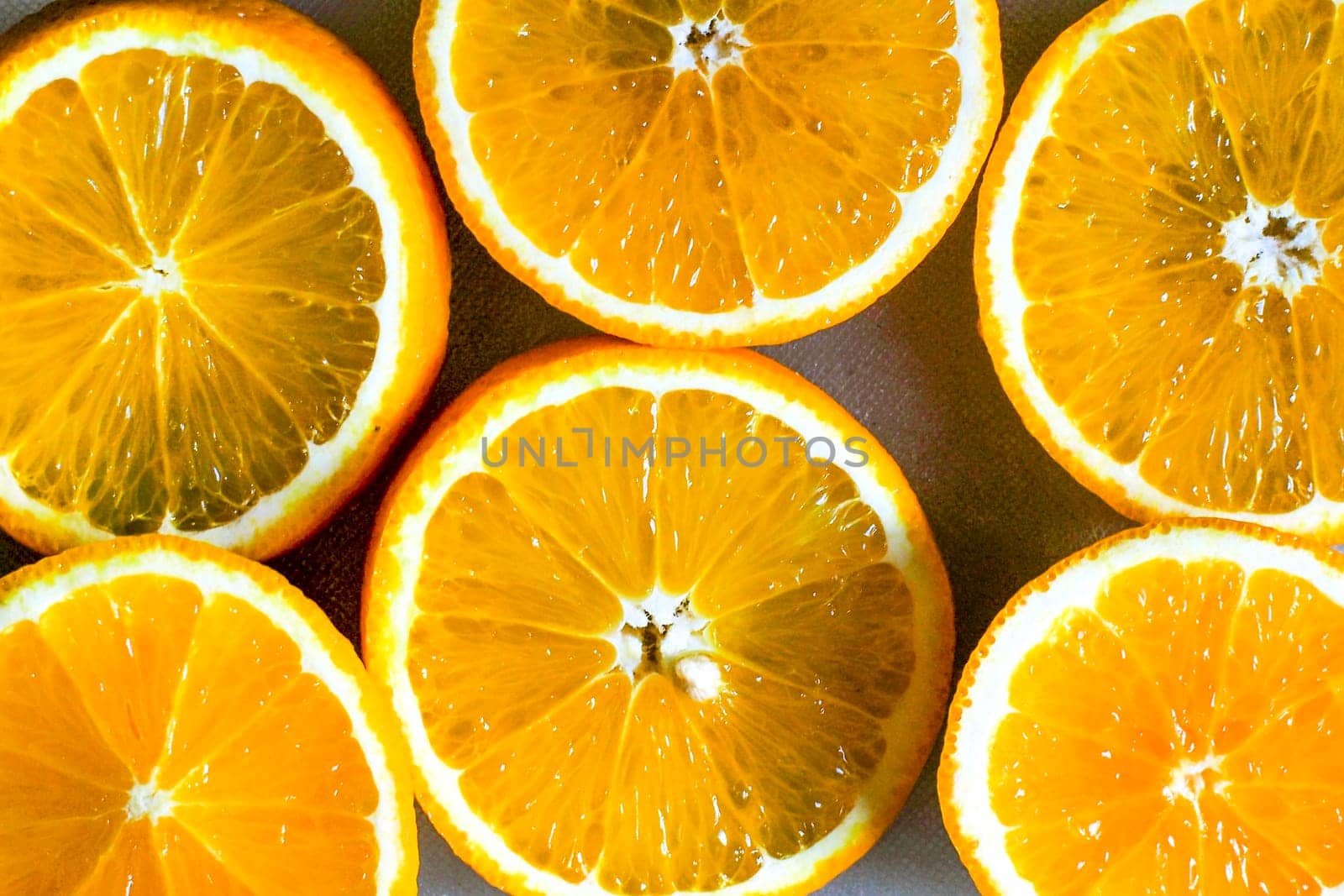 Orange slice background for summer. Background with Citrus-fruit Of Orange Slices. Juicy Slice of Orange