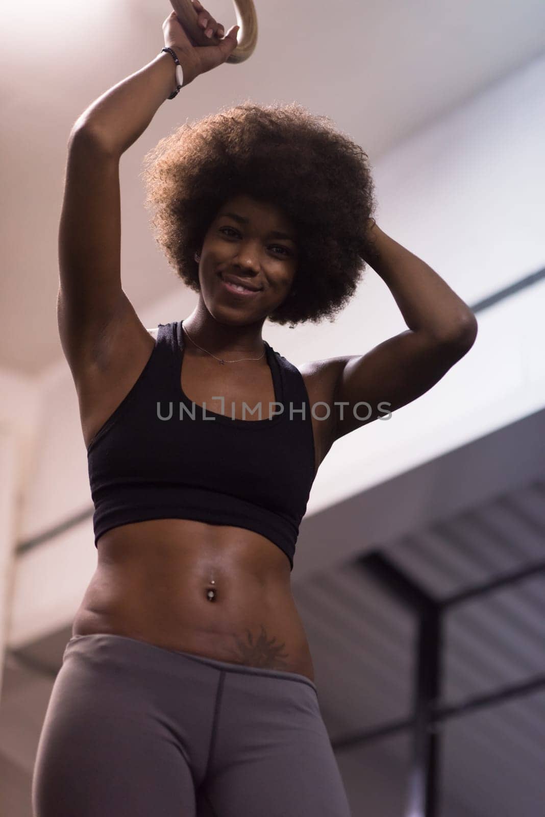 Fitness dip ring beautiful young african american woman workout at gym dipping exercise