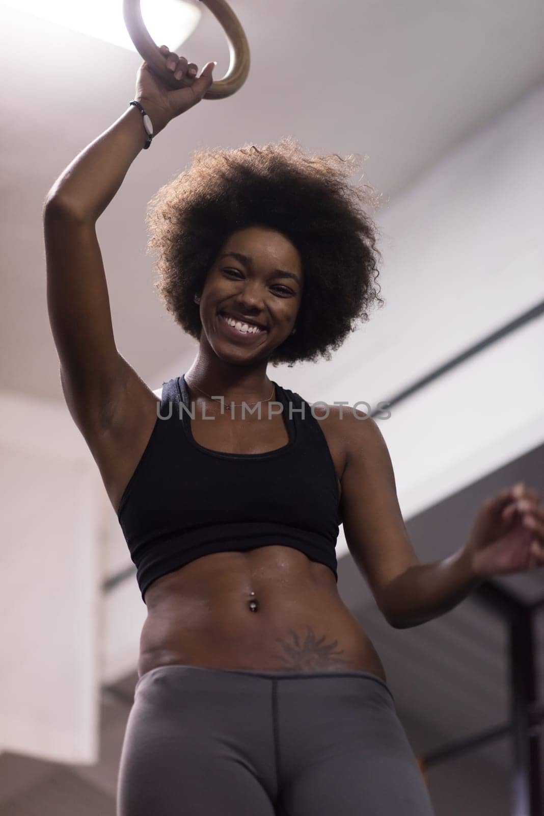 Fitness dip ring beautiful young african american woman workout at gym dipping exercise