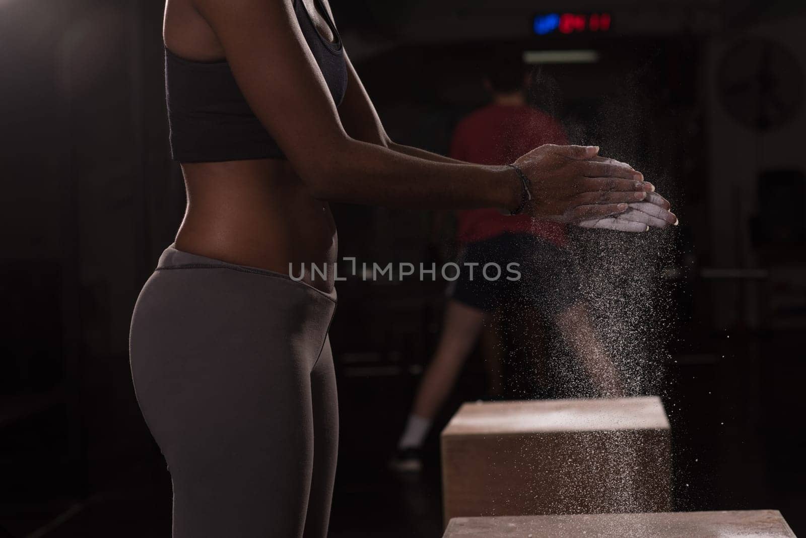 Gym Chalk Magnesium Carbonate hands clapping young african american woman for climbing workout