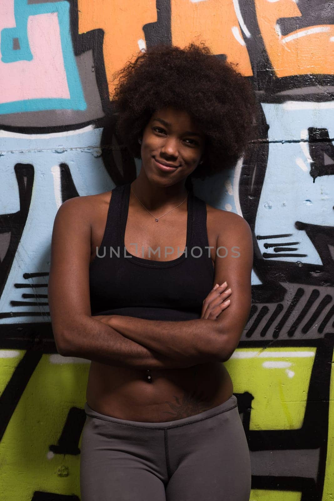 portrait of a young beautiful African American women in sports clothes after a workout at the gym
