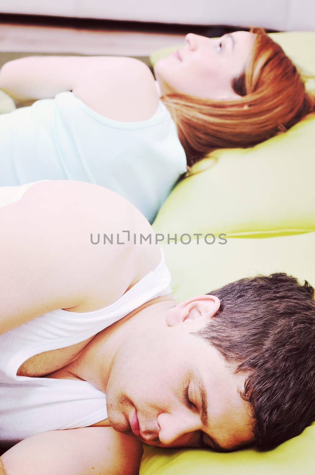 happy young couple in bed at morning