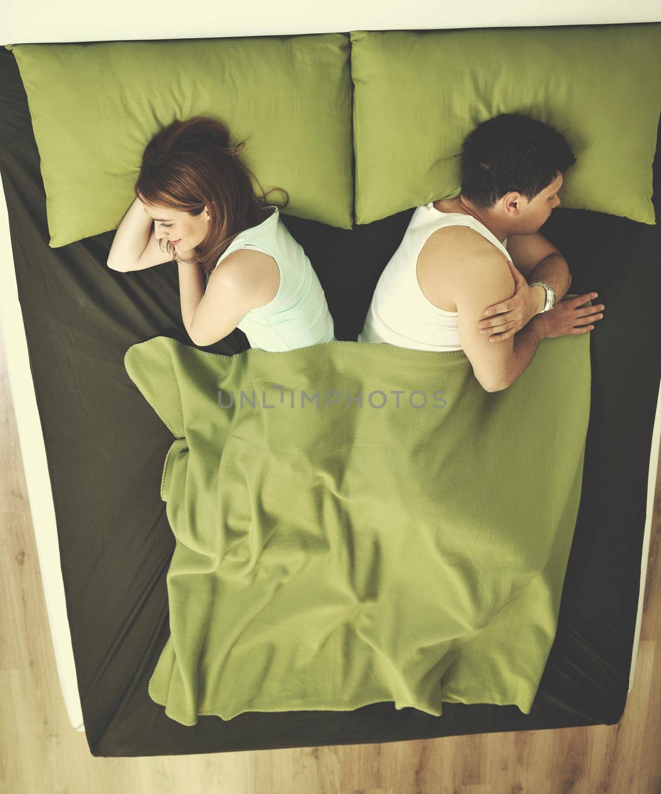 happy young couple in bed at morning