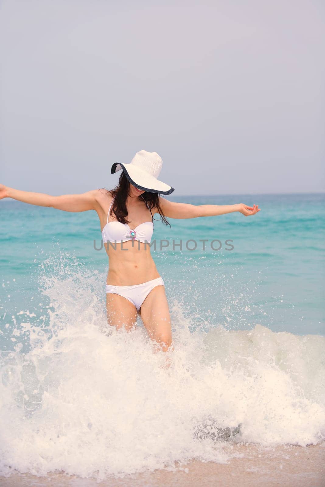 beautifel and happy woman girl on beach have fun and relax on summer vacation  over the beautiful tropical sea