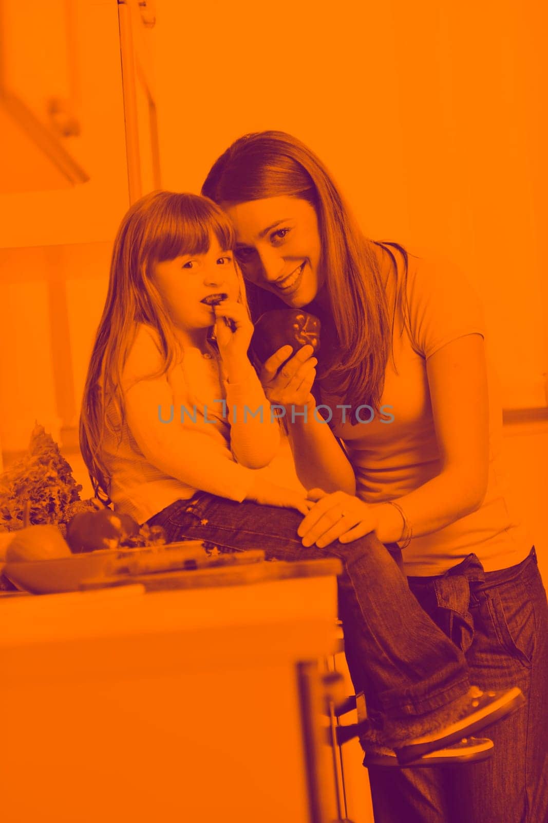 happy young family have lunch time with fresh fruits and vegetable food in bright kitchen duo tone