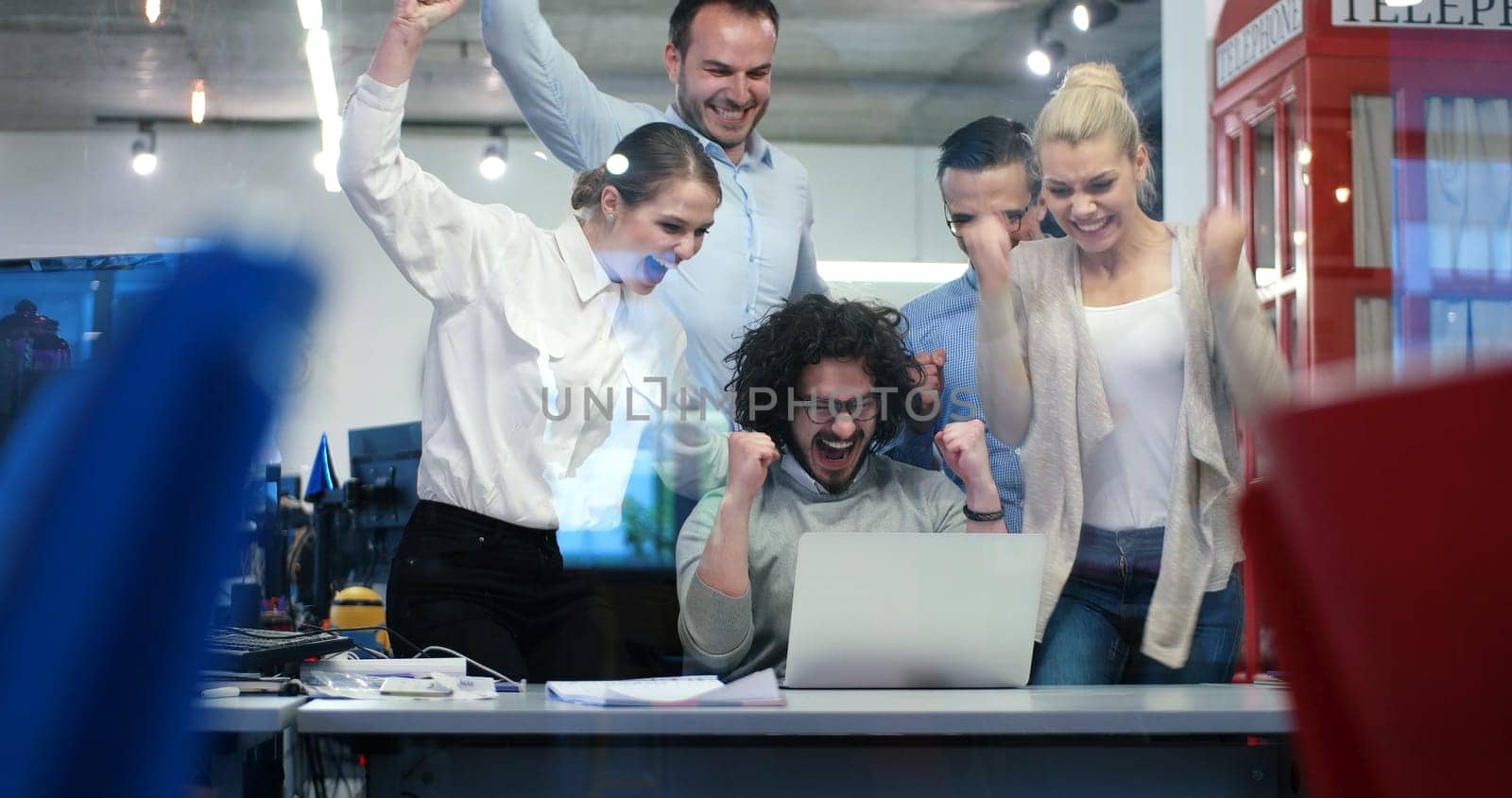 Group of a young business people discussing business plan at modern startup office building